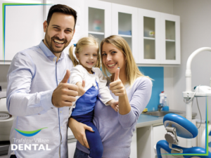 Family dentist helping a child with an emergency dental checkup