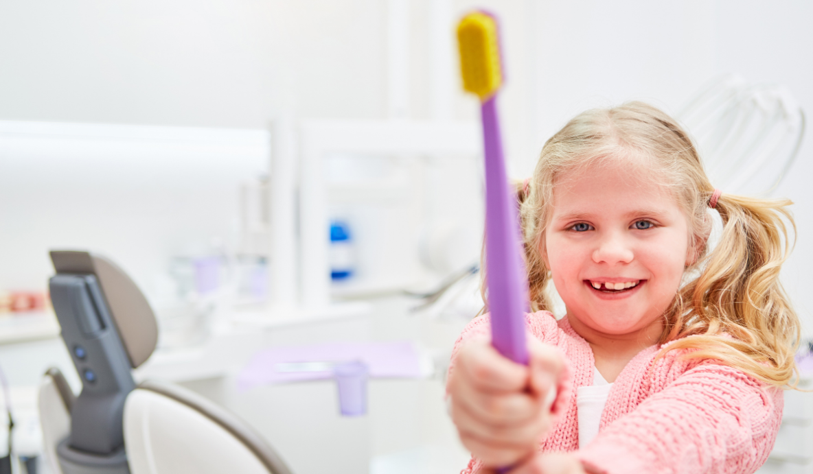 Kids dentist at Trafalgar Village Dental showing healthy snacks that promote strong teeth in children