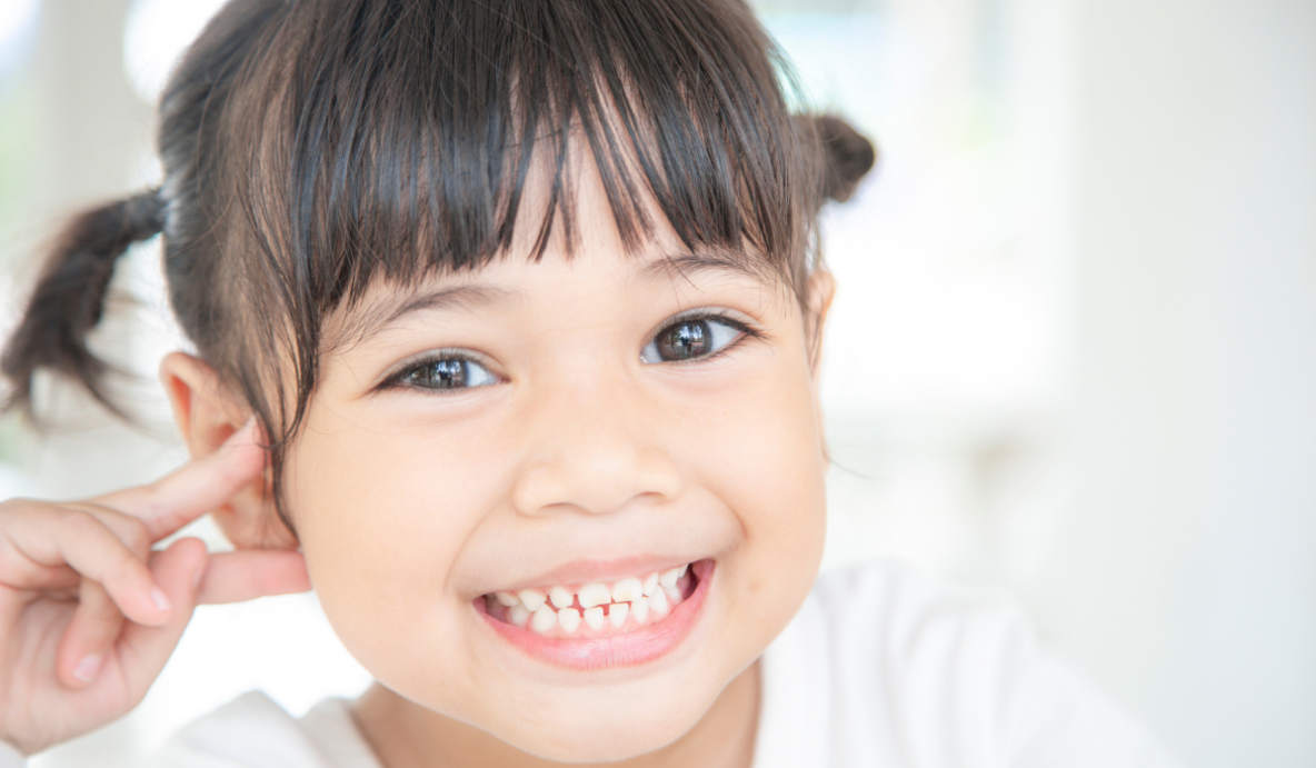 Kids dentist at Trafalgar Village Dental using anxiety management techniques with young patient in Oakville